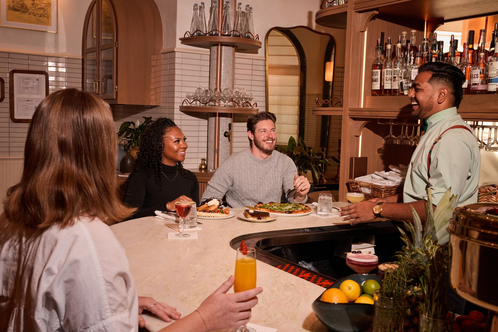 people enjoying the bar area at laurel brasserie and bar