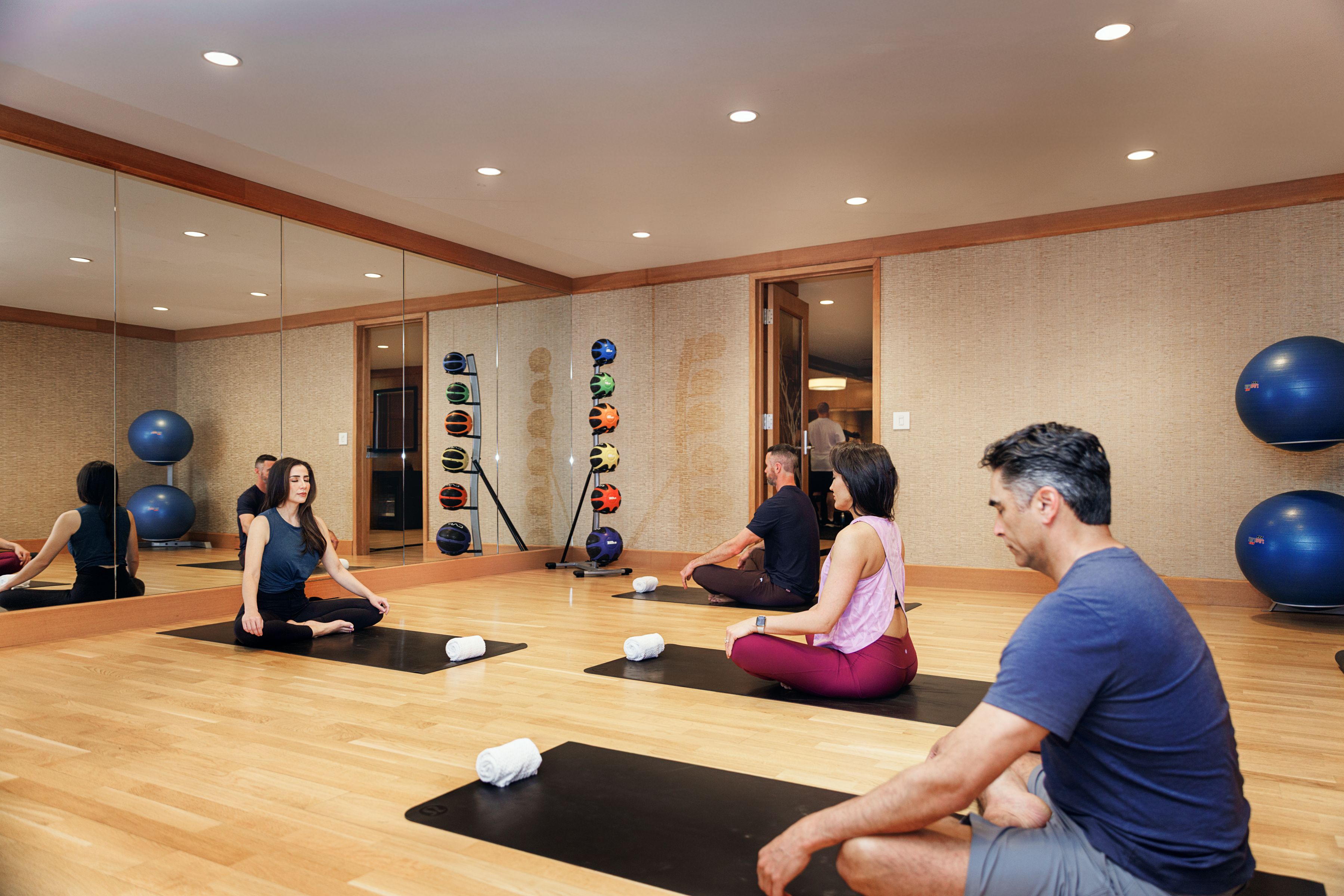 People doing yoga in a fitness area
