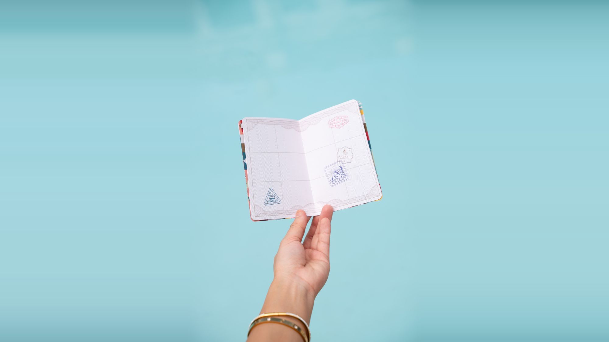 hand holding the summer celebration series passport book