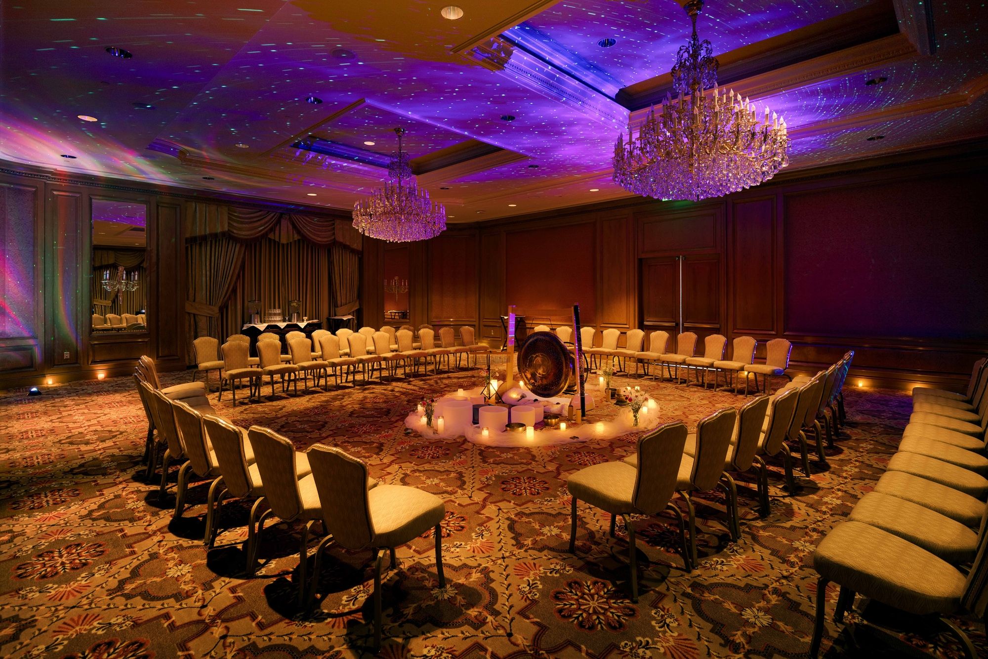 sound bath setup with surrounding chairs