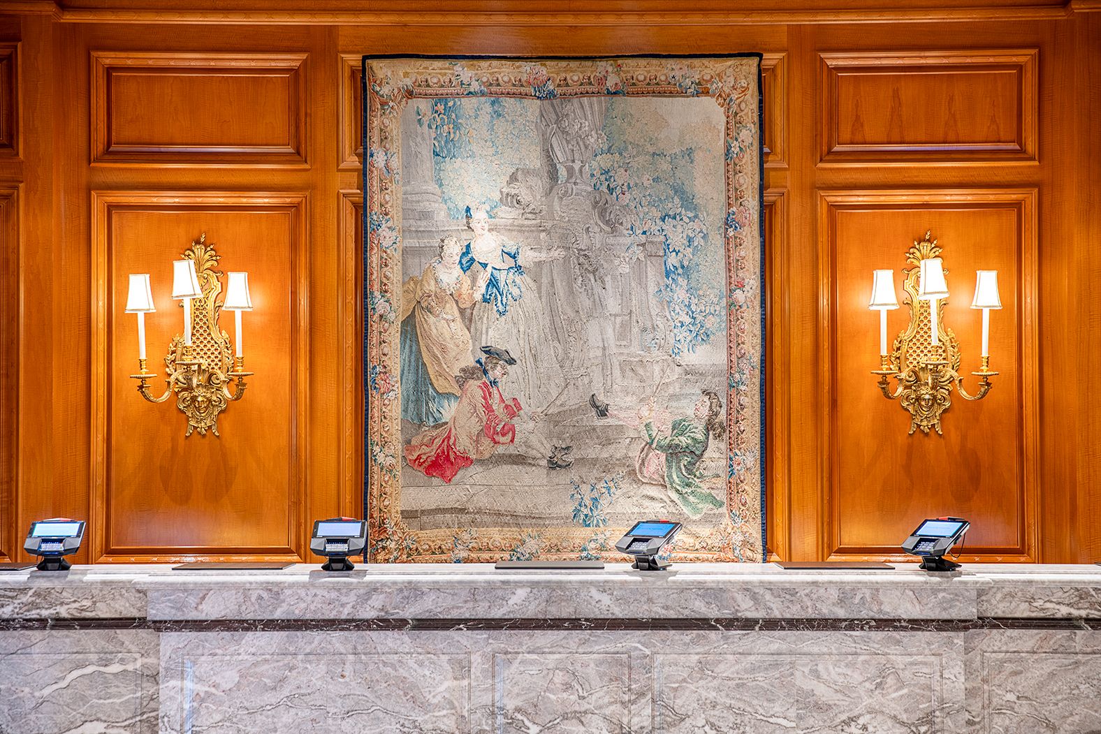 Front desk with a painting hanging behind it