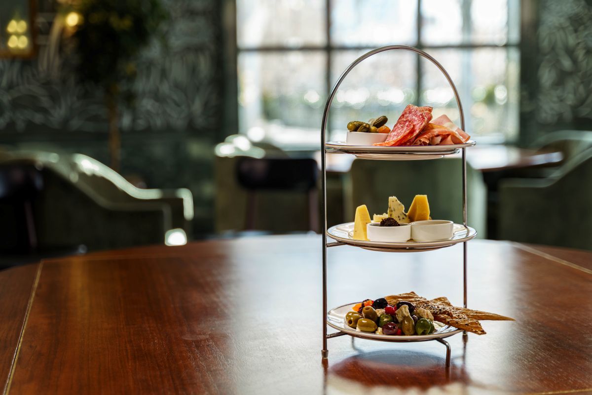 Three tier stand with charcuterie plates