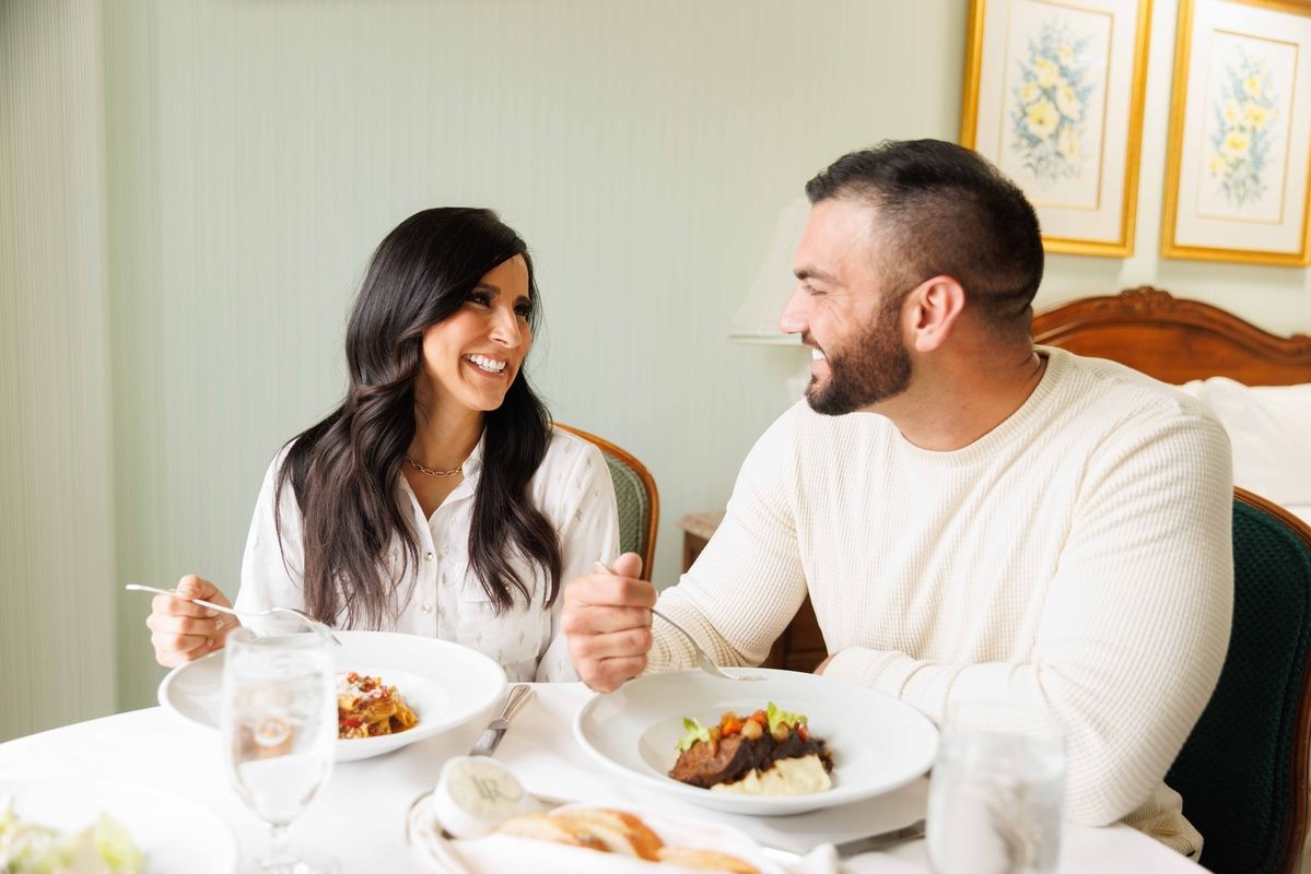 man and woman eating at a table