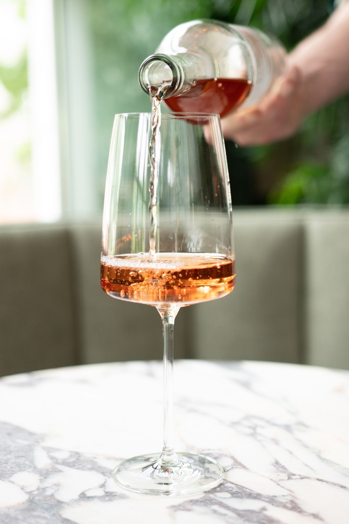 glass of wine being poured