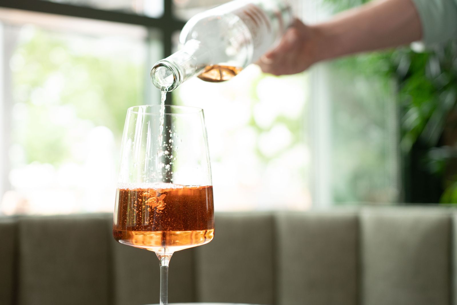 glass of wine being poured