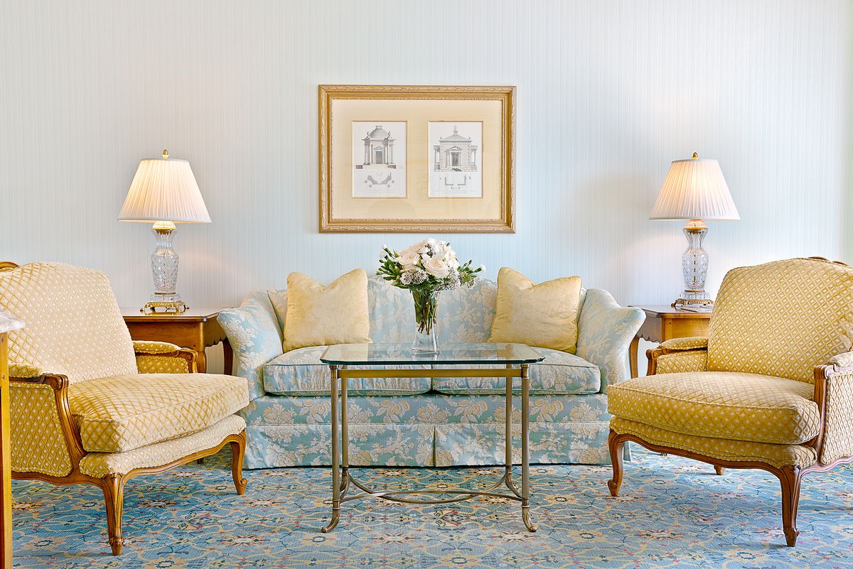 executive suite king living room rest area with couch and chairs