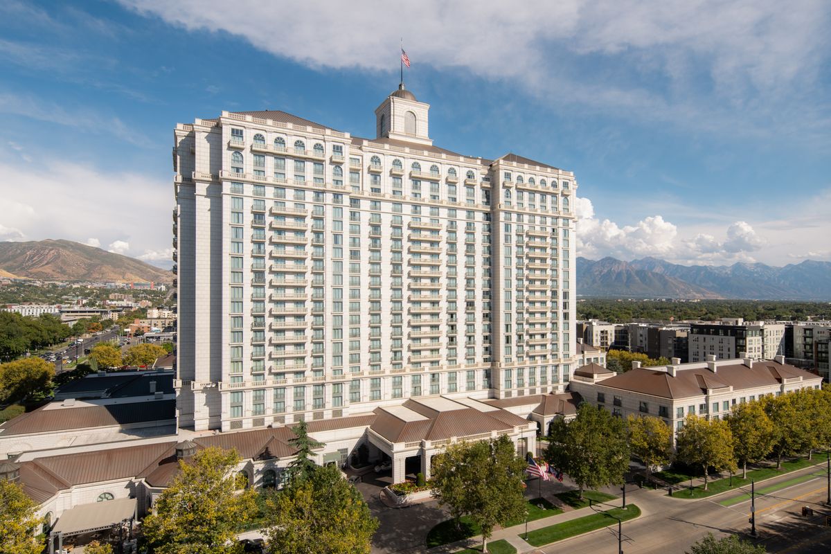 Grand America Hotel against the mountains and Salt Lake City skyline