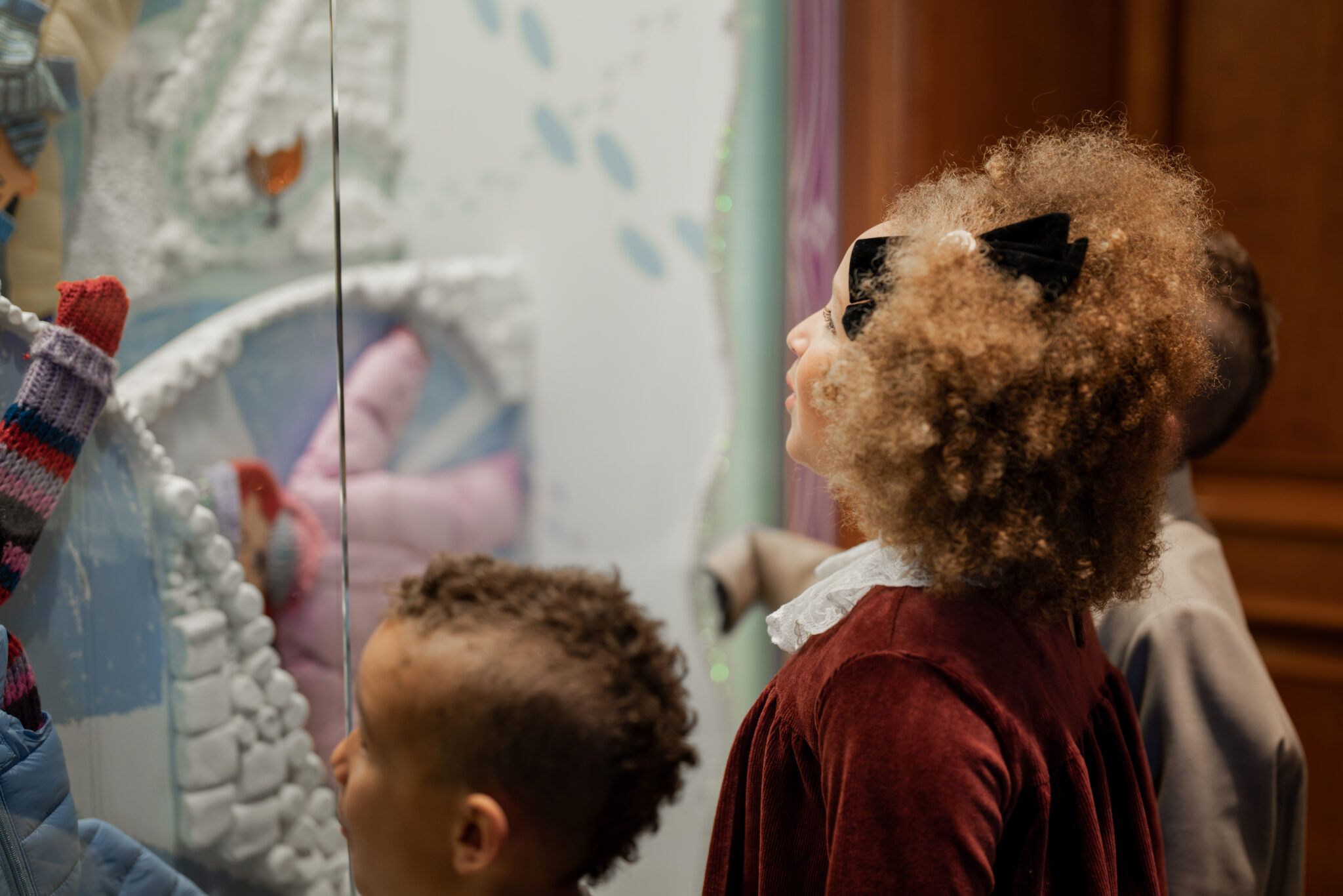 kids looking at a window