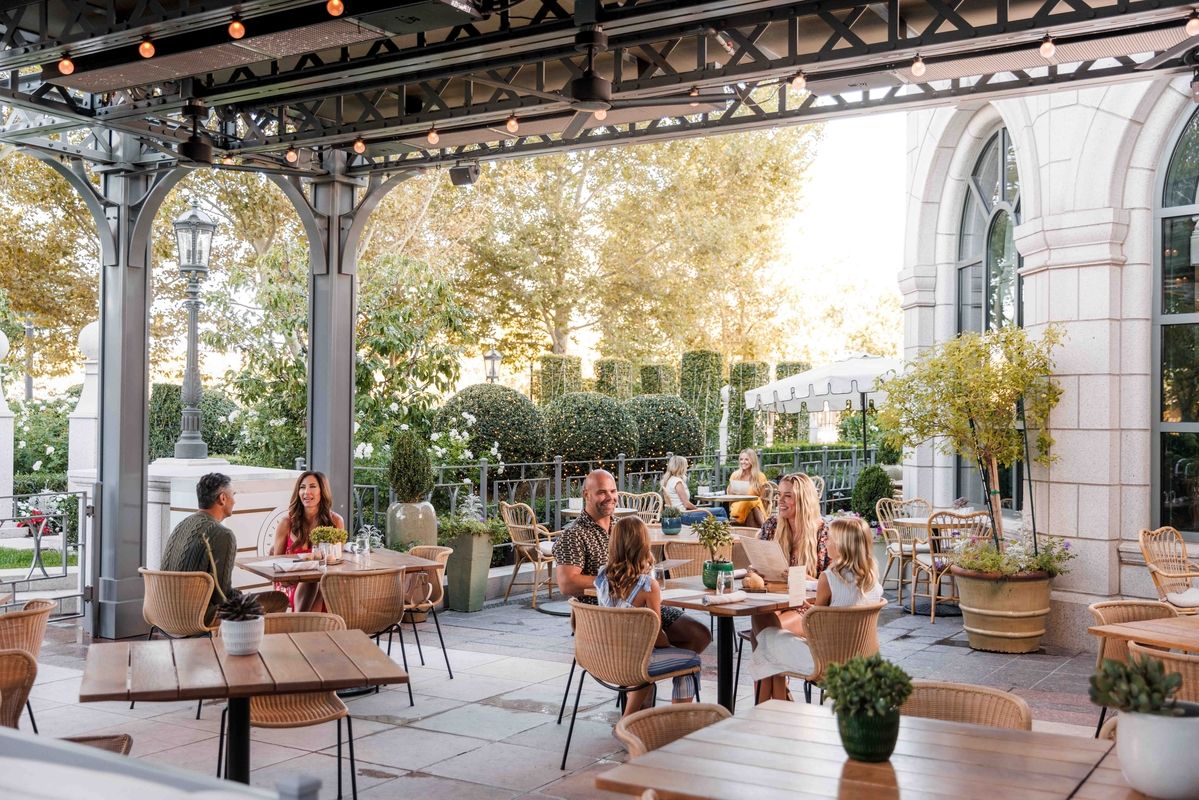 people enjoying meals on the outdoor patio of Laurel Brasserie and Bar