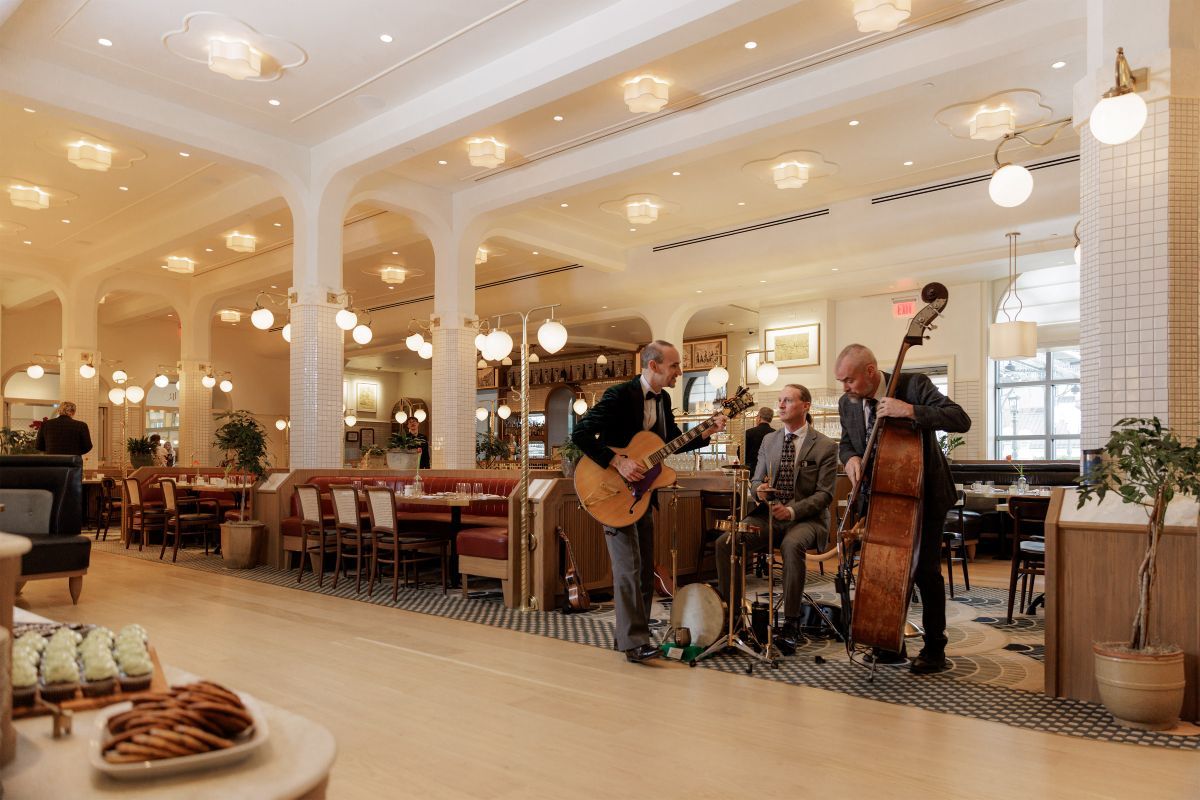 further away shot of three men playing instruments