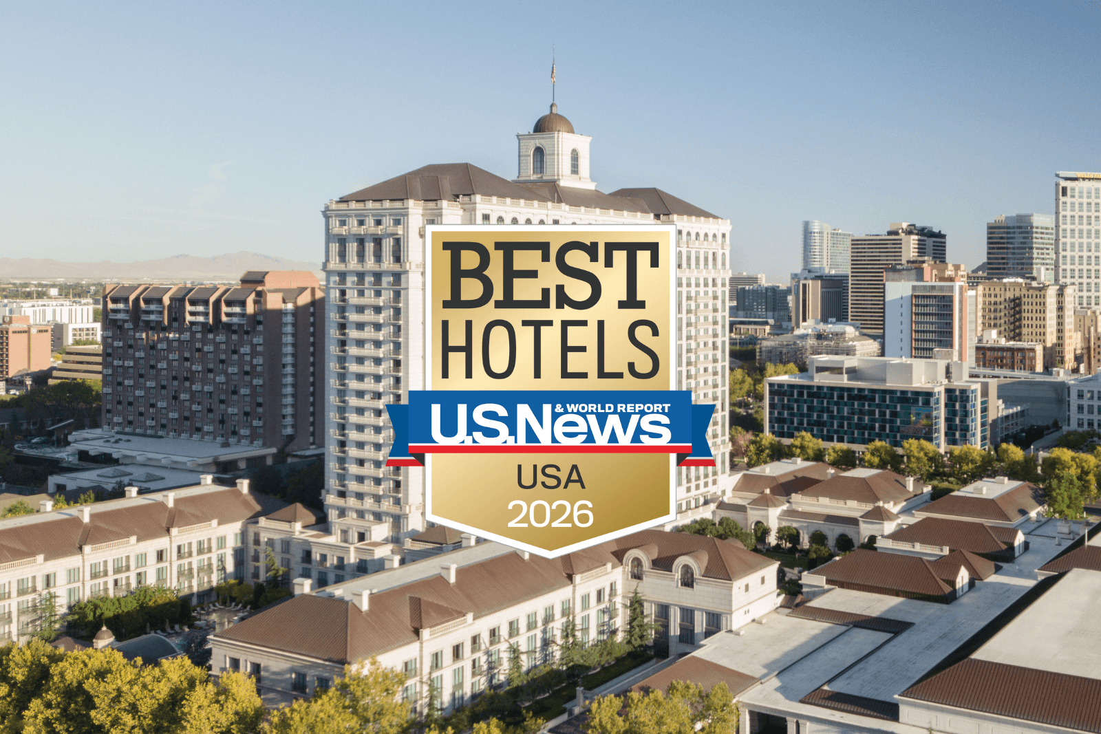 The Grand America Hotel exterior with gold best hotels badge