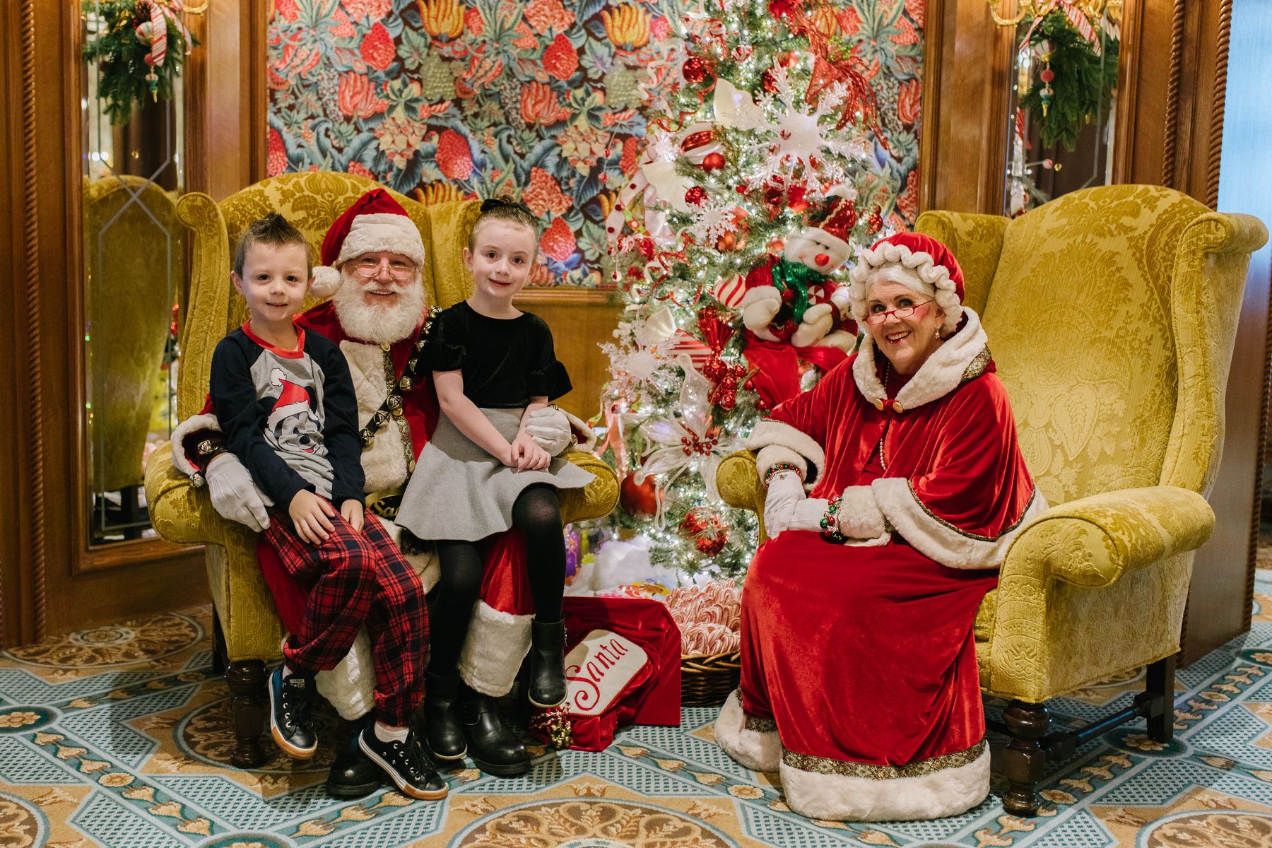 Children pose with Santa and Mrs. Claus