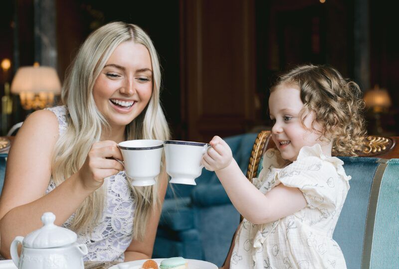 Elegant hotel suite with comfortable seating and mountain view