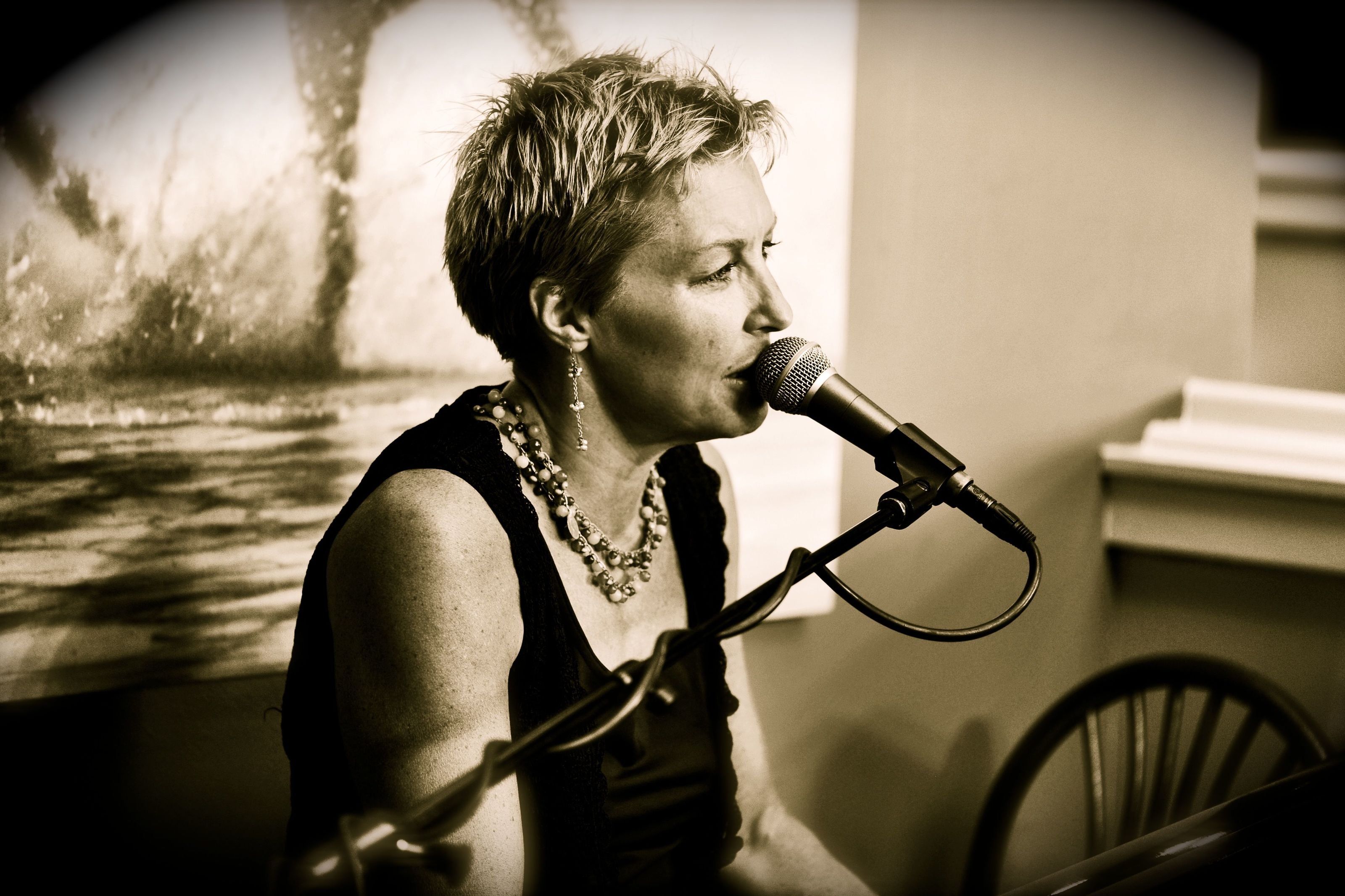 woman singing into microphone