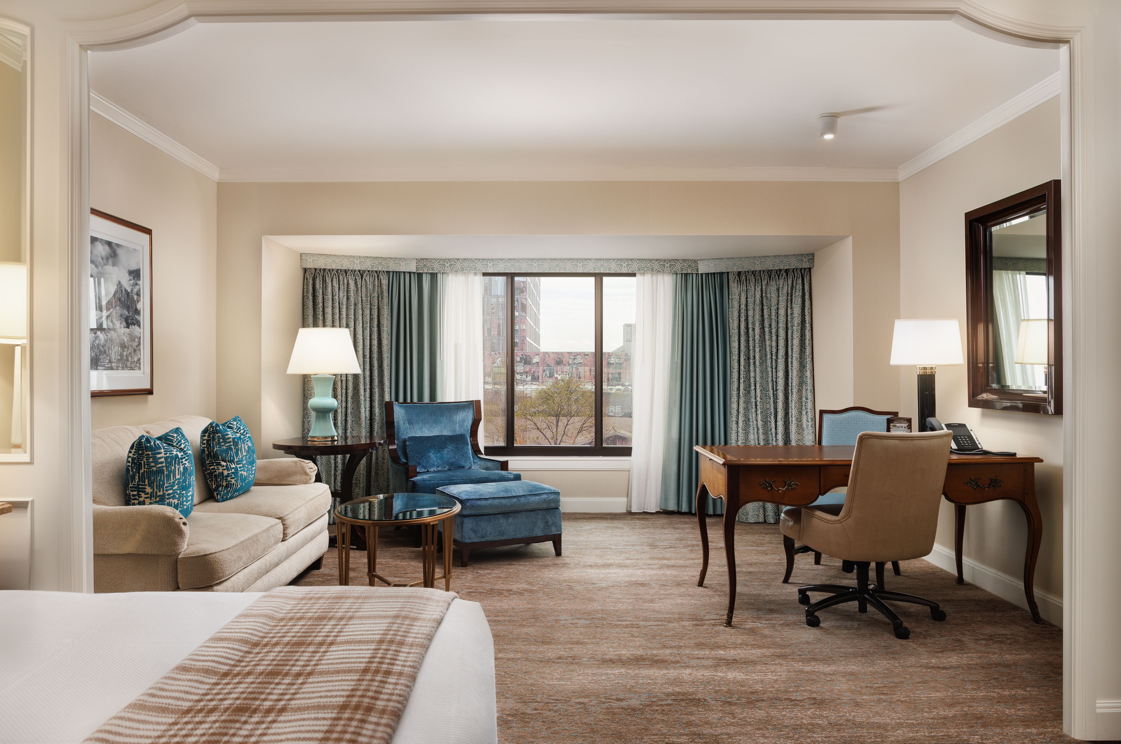 Tower Room in Little America Salt Lake City with king bed and sitting area.