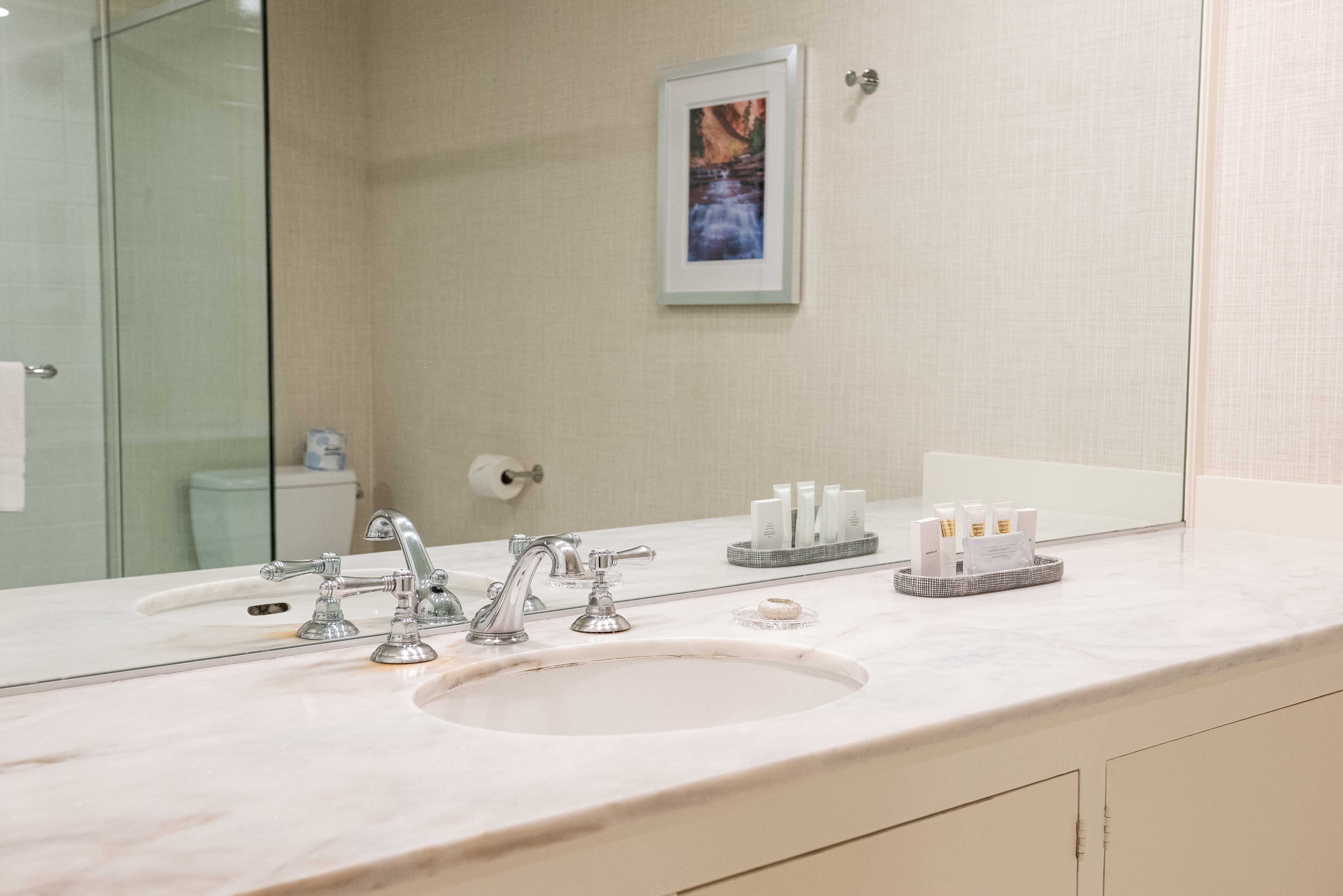 Garden Room bathroom with vanity and shower.