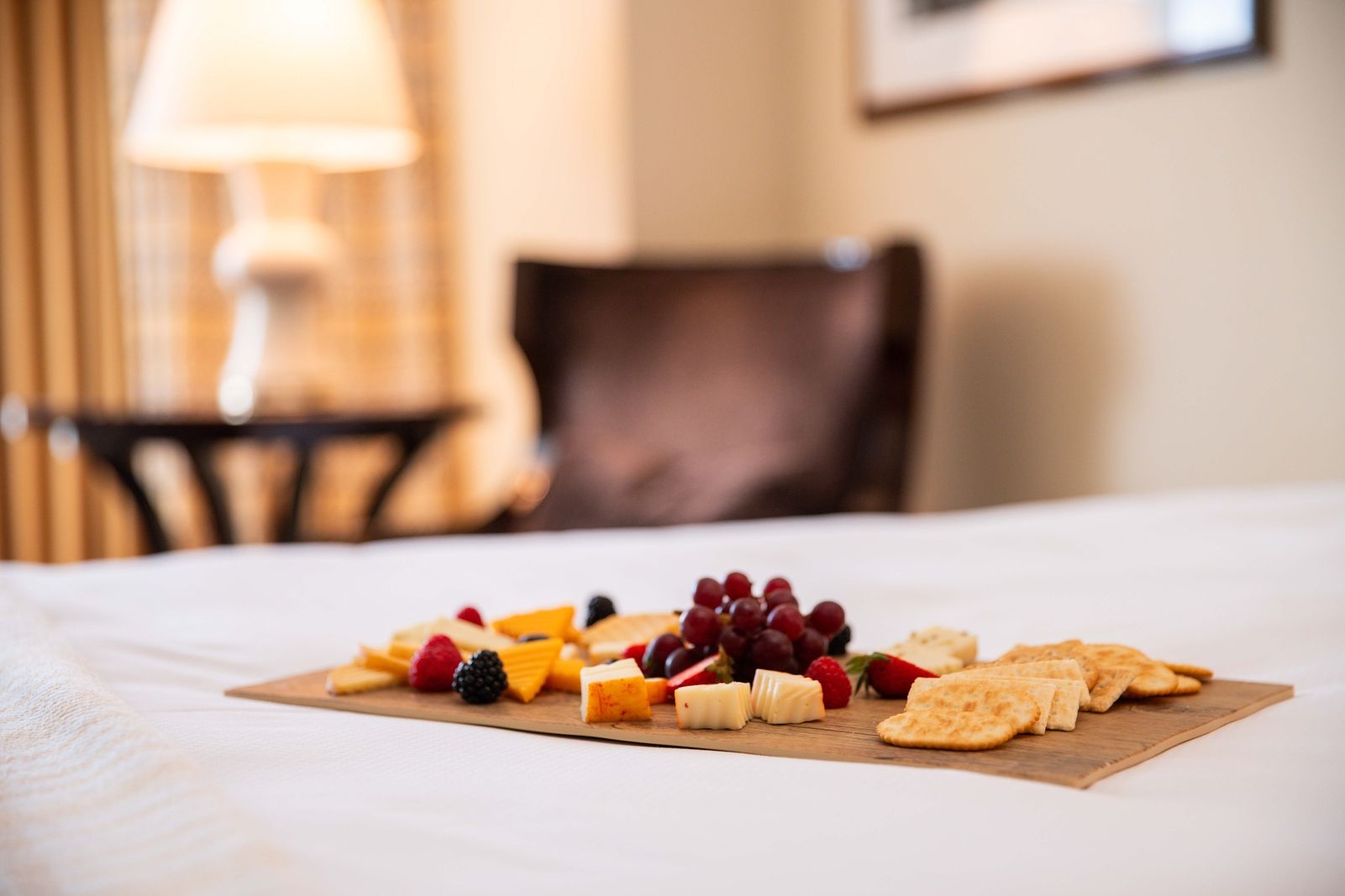 charcuterie board on a bed